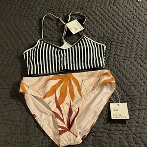 Bikini. High waist bottoms. Adjustable straps on top. Top has removable pads.